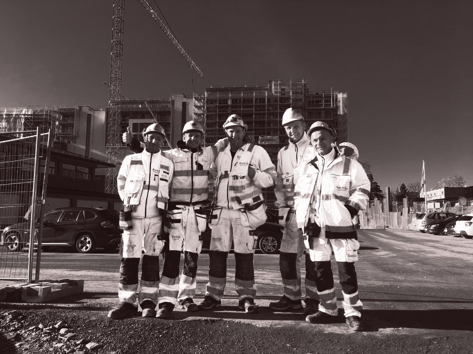 Arbeidere i verneutstyr på arbeidsplass